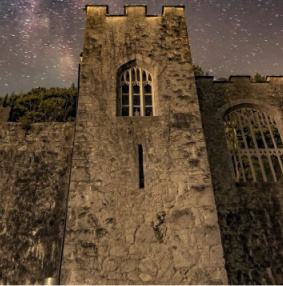 Close up of Gwrych Castle with stars above